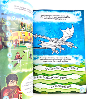 Lego Harry Potter - Pustolovine u Hogwartsu Open book with illustrations of a dragon and characters, likely from a children's book.
