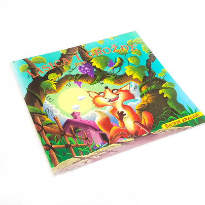 Lisica i Grožđe Children's book cover with cartoon fox and bear characters on a white background
