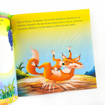 Lisica i Grožđe Illustrated book page with a fox character on a colorful background