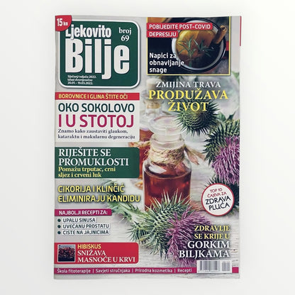 Magazine cover with text and images of plants and a bottle on a white background