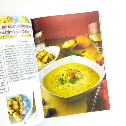 Mediteranske Travarice i Likeri Magazine or book open to a page with a recipe for champignon soup, featuring a bowl of soup and ingredients.
