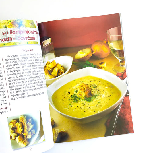 Mediteranske Travarice i Likeri Magazine or book open to a page with a recipe for champignon soup, featuring a bowl of soup and ingredients.