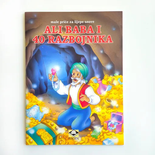Mini Slikovnica – Ali Baba i 40 Razbojnika Book cover of 'Ali Baba i 40 razbojnika' with a colorful illustration of a character in a cave filled with gold.