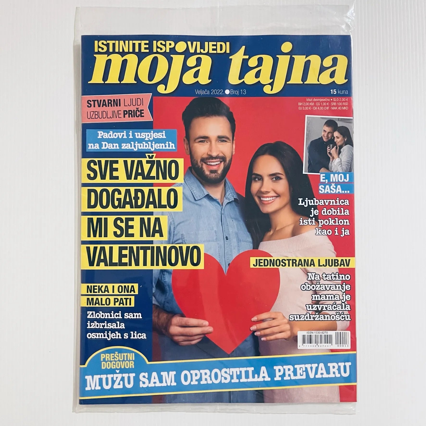 Moja Tajna Magazine Croatian Magazine cover with a couple holding a heart and text in Croatian