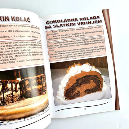 Naši Najljepši – Kolači Open cookbook showing a chocolate roll cake recipe with a slice of cake on a plate. shopncro
