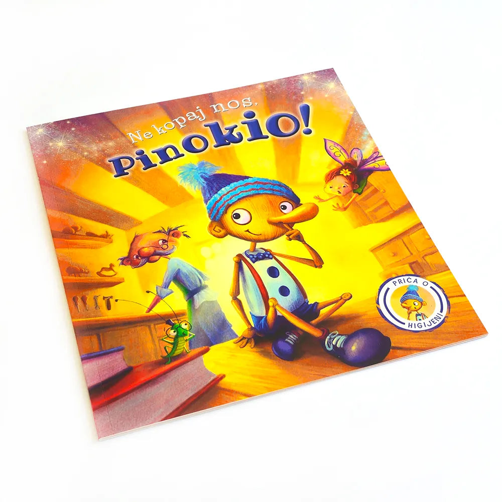 Ne kopaj nos, Pinokio! Colorful book cover of 'Pinokio' with animated characters on a white background