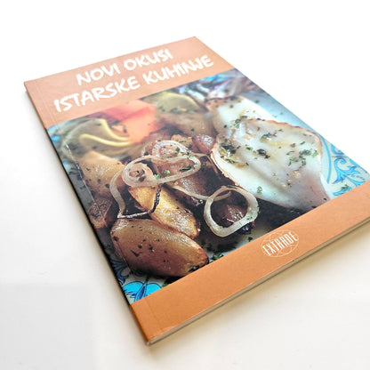Novi Okusi Istarske Kuhinje Cookbook with a cover featuring grilled food and text on a white background