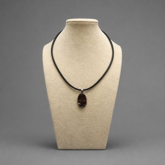 Oče Naš Necklace – Sliding Pendant Necklace with a pendant on a beige mannequin bust against a gray background hopncro