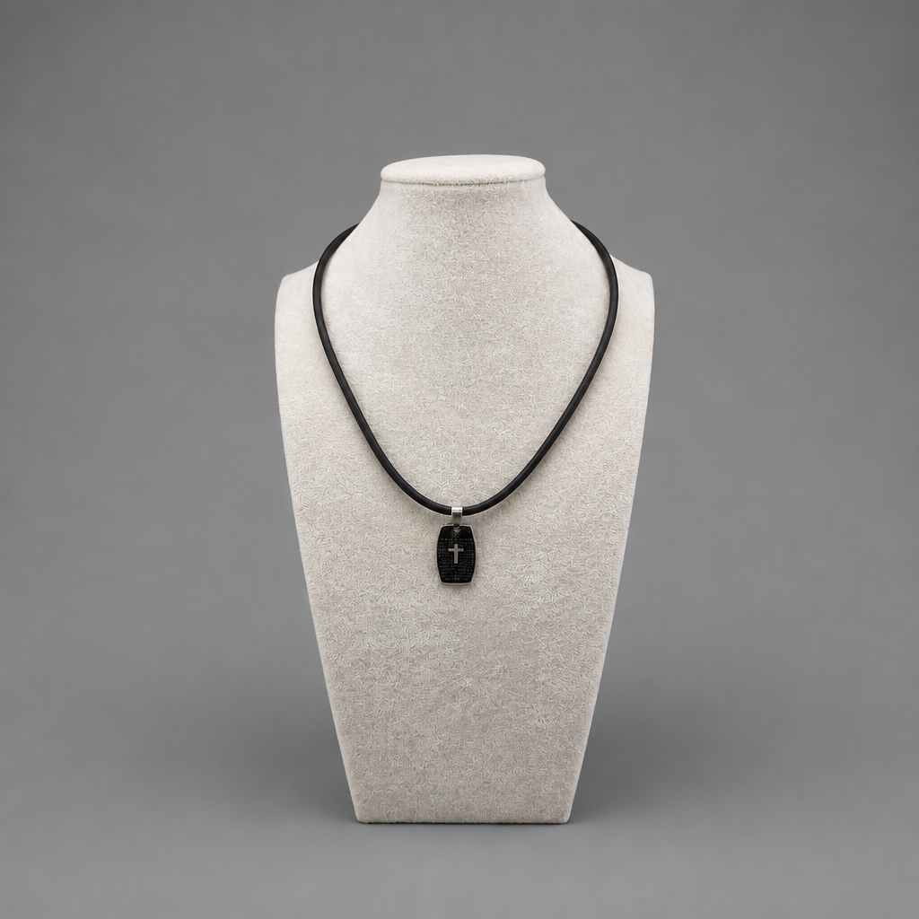 Oče Naš Necklace Necklace with a black pendant on a mannequin bust against a gray background