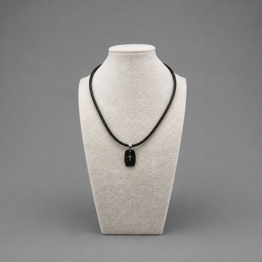Oče Naš Necklace Necklace with a black pendant on a mannequin bust against a gray background