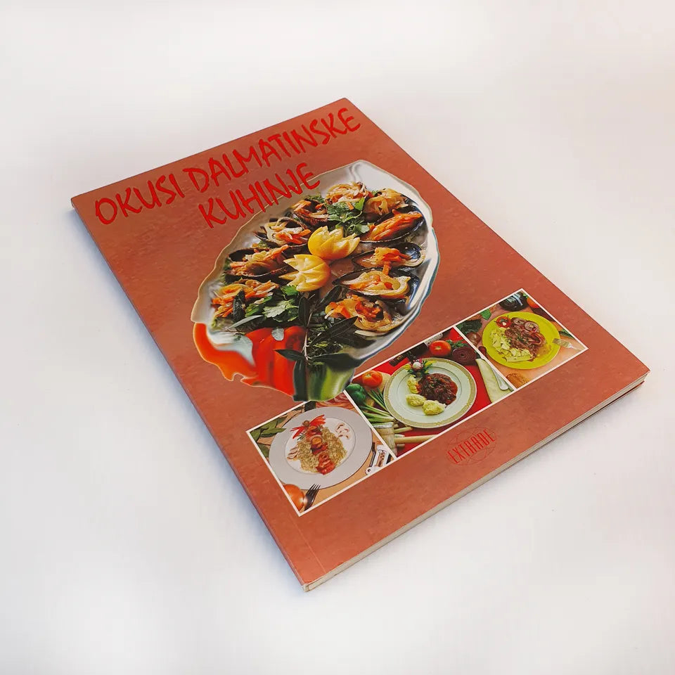 Okusi Dalmatinske Kuhinje Cookbook titled 'Okusi Dalmatinske Kuhinje' with images of food on the cover, on a white background.