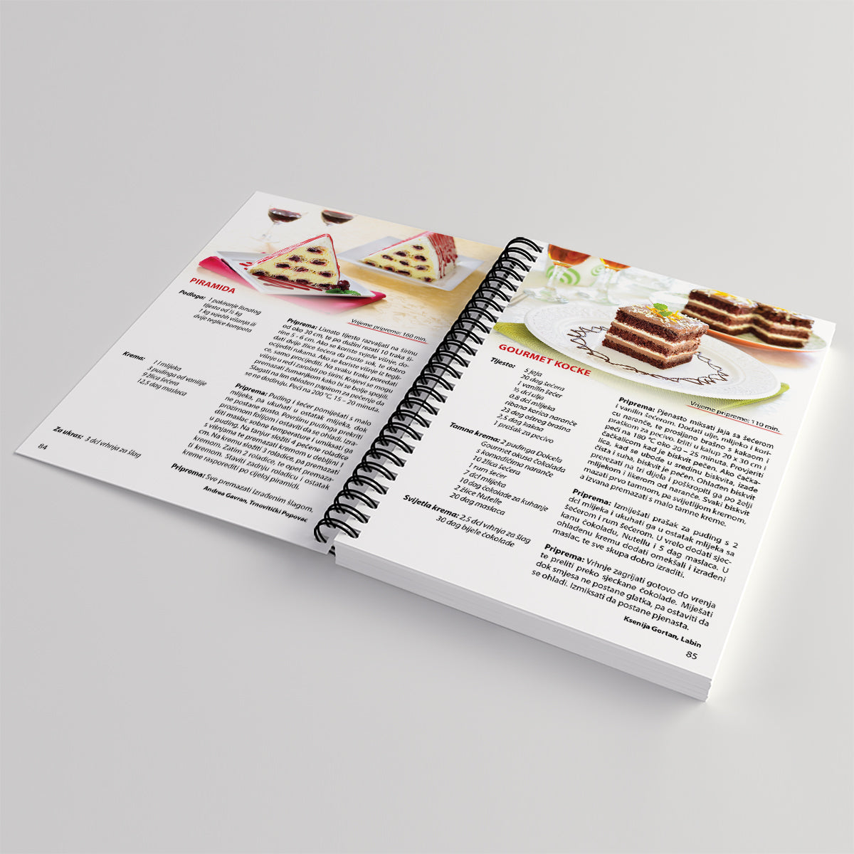 PREMIUM KOLAČI – Deserti i Slastice Open cookbook on a gray background