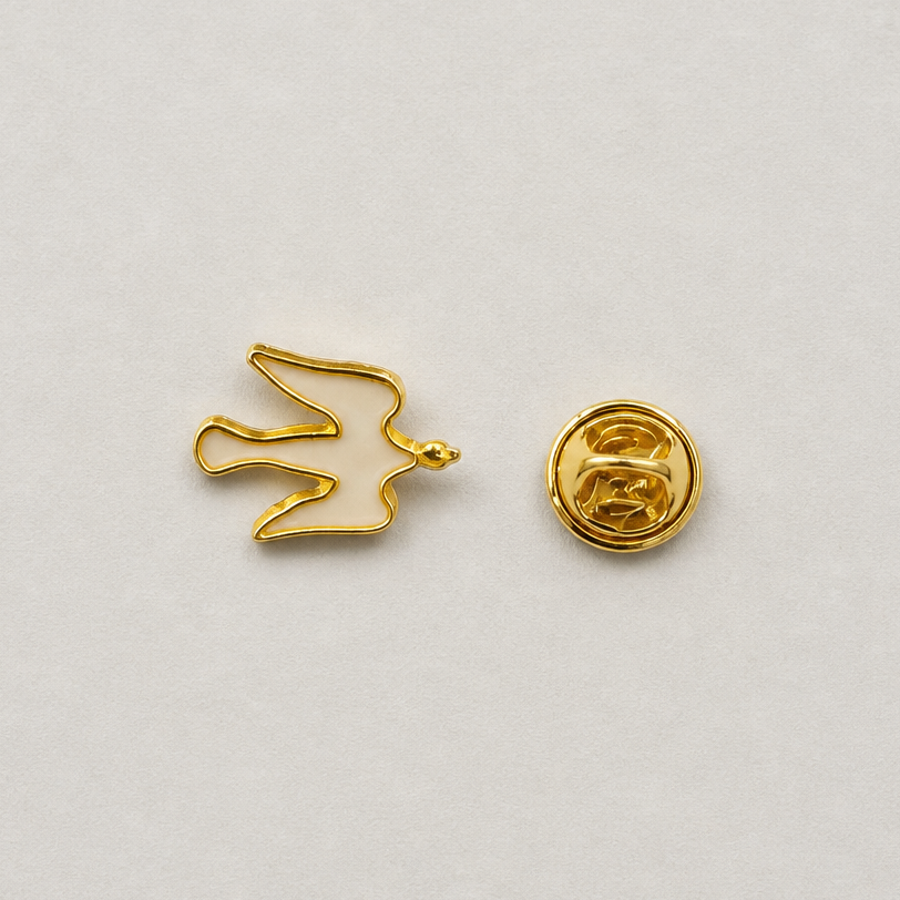 Pin Međugorje - Dove A small gold bird-shaped pin shown from the front and back on a light gray background.