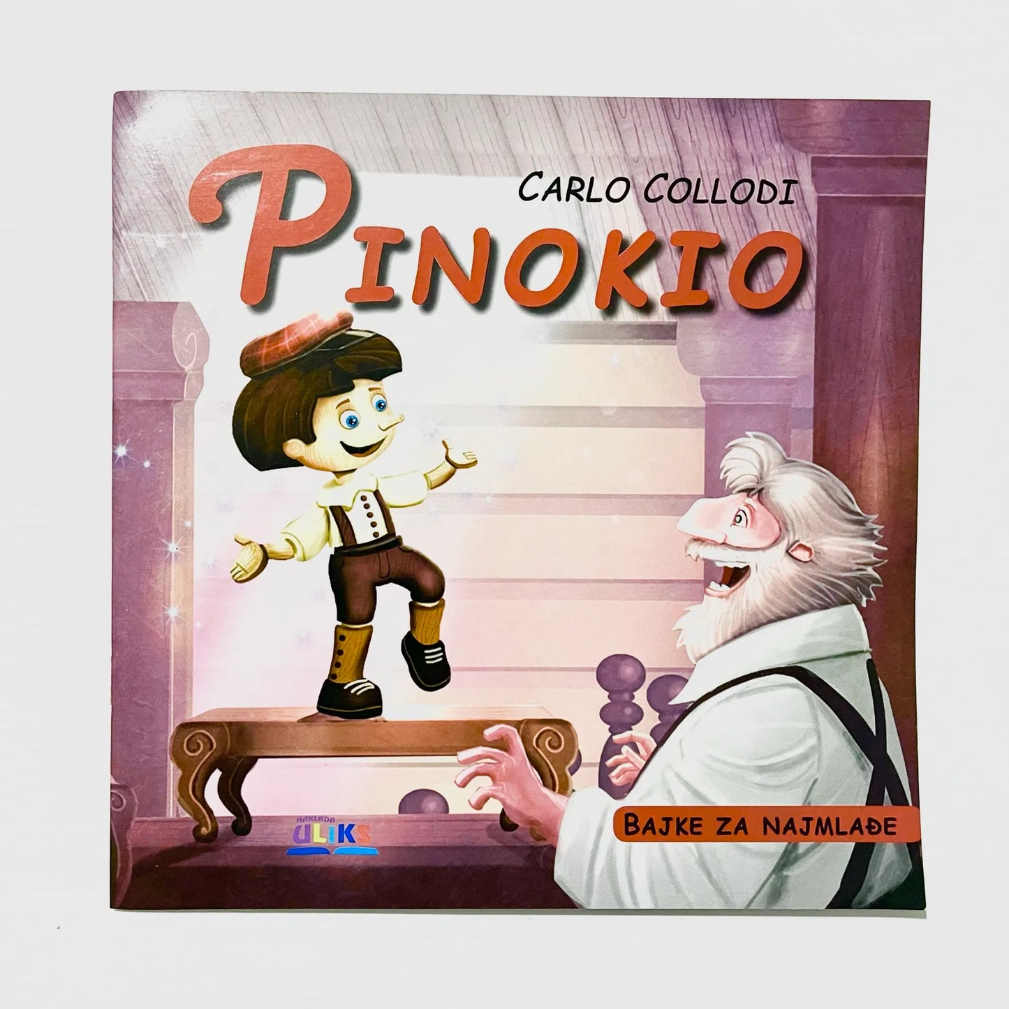 Pinokio Book cover of 'Pinokio' by Carlo Collodi with illustrations of Pinokio and an old man.