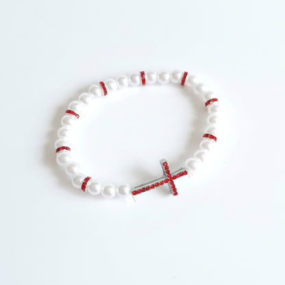 Red & White Cross Bracelet – Handmade Elastic Beaded Jewelry White beaded bracelet with red accents and a silver cross on a white background