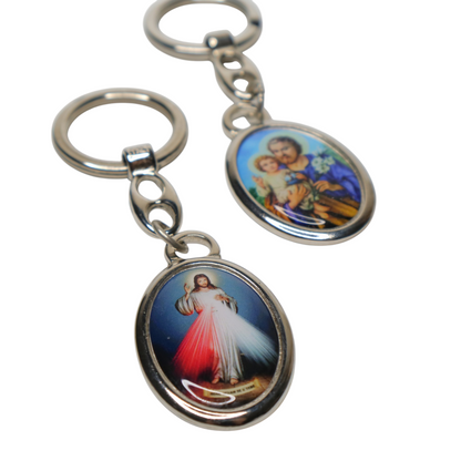 Religious Croatian Metal Keyring – Dual‑Sided Devotional Pendant Two keychains with religious-themed designs on a white background