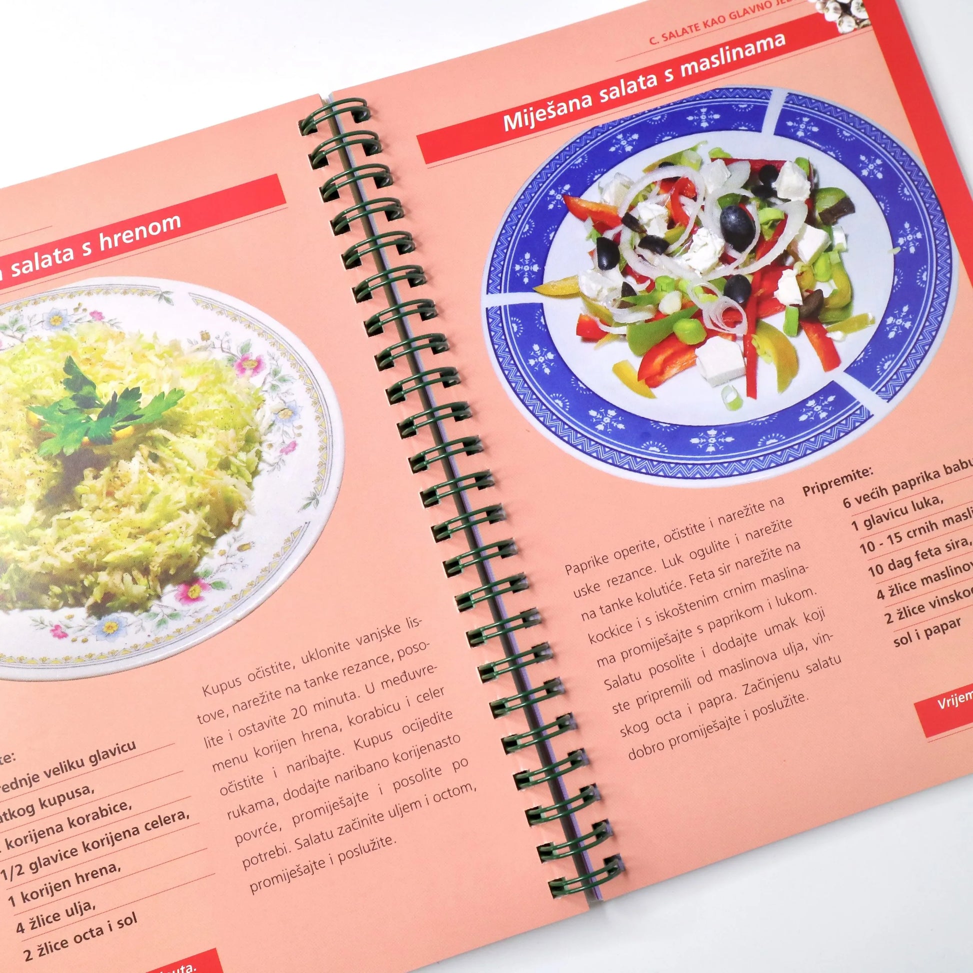 Salate - Prilog, Jela i Desert Cookbook with spiral binding showing pages of salad recipes and images.
