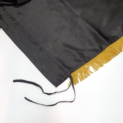 Silk Flag Plain Black with gold fringes 200cm x 100cm Black graduation gown with gold trim on a white background