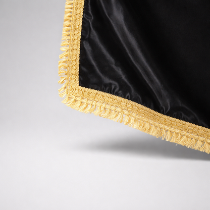 Silk Flag Plain Black with gold fringes 200cm x 100cm Black fabric with gold trim on a gray background
