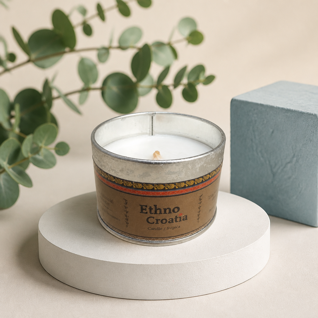 Scented Candle – Traditional Cookie (Ethno Croatia) Candle with 'Ethno Croata' label on a white pedestal with green leaves in the background shopncro