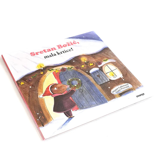 Sretan Božić, Mala Krtice! Children's book with a colorful illustration of a house and a character on the cover.