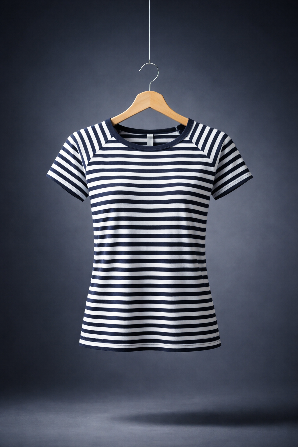 T-shirt Dalmatia Boat Neck Black and white striped t-shirt on a wooden hanger against a dark background