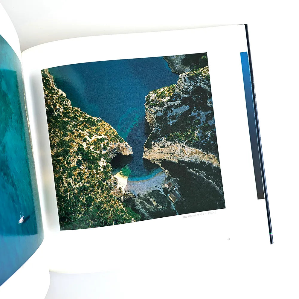 The Beauty of Croatia Open book with an aerial view of a coastal landscape on a white background