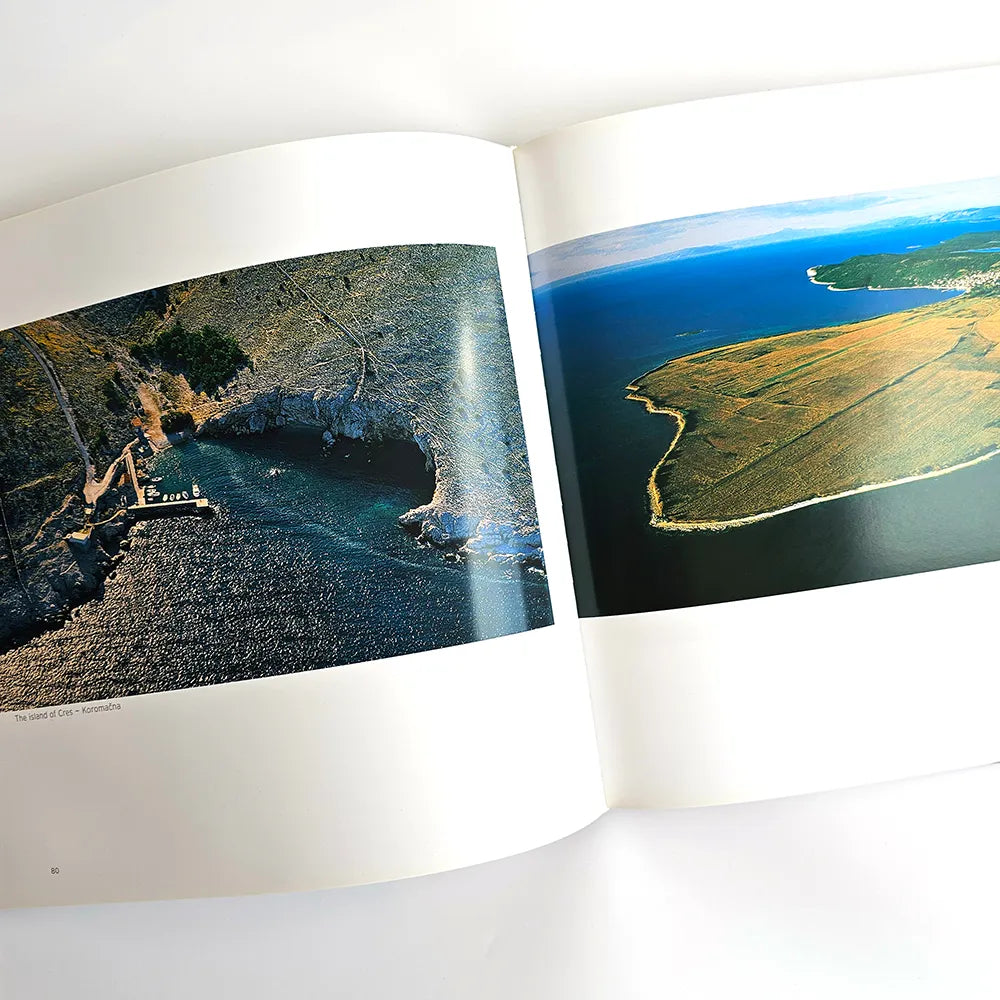 The Beauty of Croatia Open book showing two scenic images of coastal landscapes.