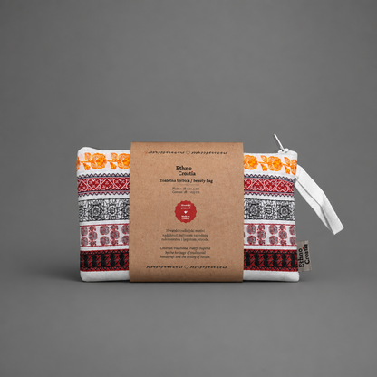 Toaletnu Torbica / Beauty Bag - Ethno Croatia Fabric pouch with traditional patterns and a brown label on a gray background