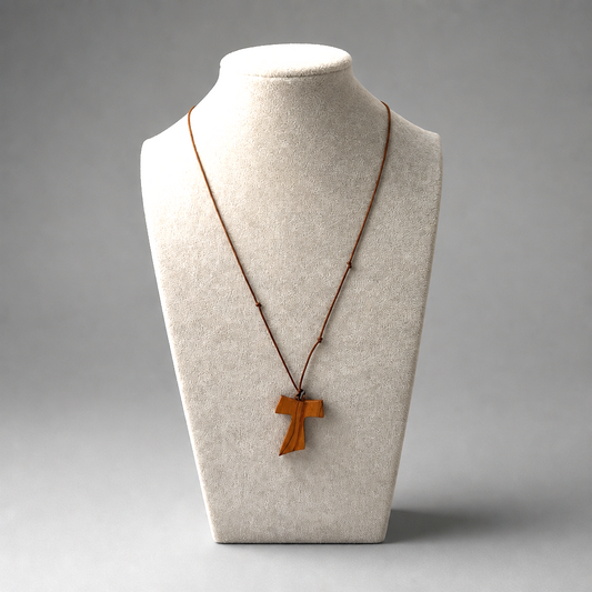 Traditional Međugorje Necklace (L) Wooden cross necklace on a mannequin bust with a gray shopncro background
