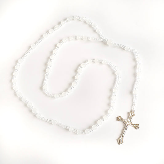 White Bead Catholic Rosary – Silver Crucifix Silver rosary with a cross on a white background