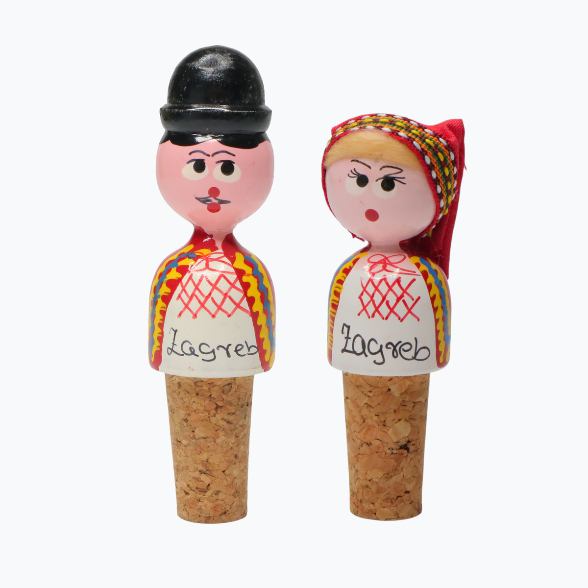 Wine Cork Boy & Girl Set Two decorative bottle stoppers shaped like dolls with colorful outfits and 'Zagreb' text on a white background.
