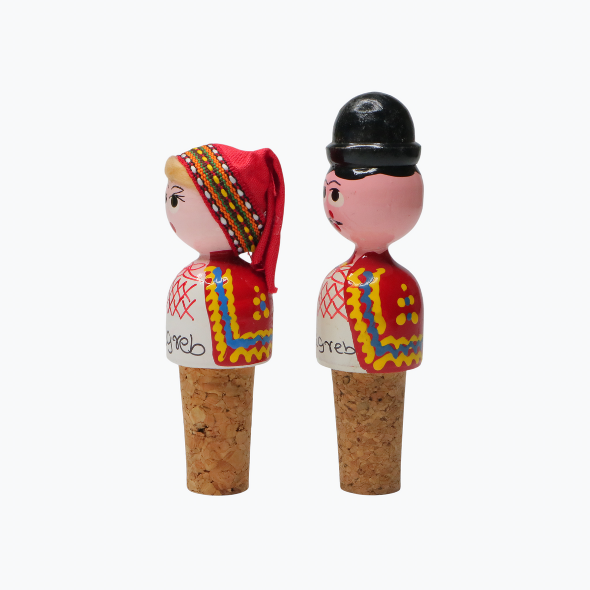 Wine Cork Boy & Girl Set Two cork stoppers with decorative figures on a white background
