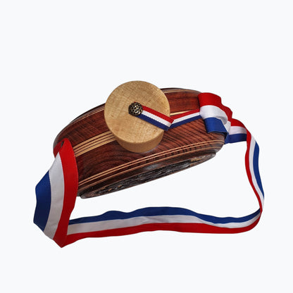 Wooden object with a decorative ribbon on a white background