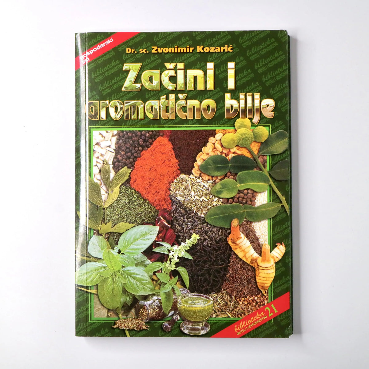 Začini i Aromatično Bilje Book cover of 'Zažini i aromatićno bilje' with images of herbs and spices on a white background