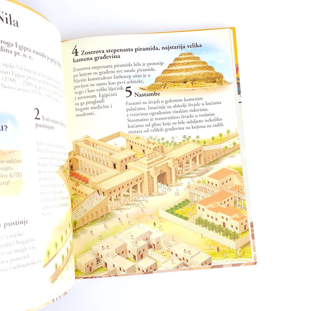 101 Činjenica Koju Treba da Znaš o Egiptu Open book showing illustrations of ancient architecture, likely from a geography or history textbook.